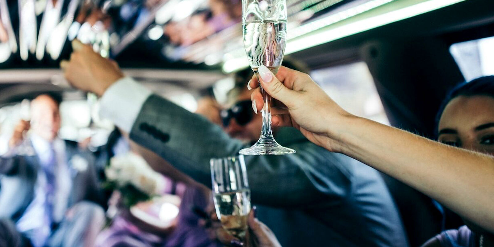 person holding clear wine glass